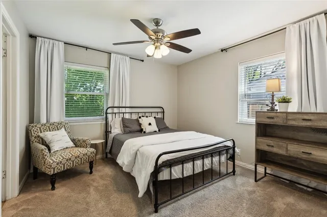 a bedroom with a bed and window