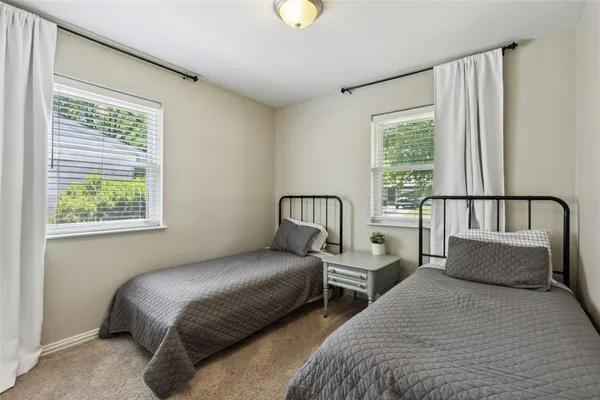 a bedroom with bed and window