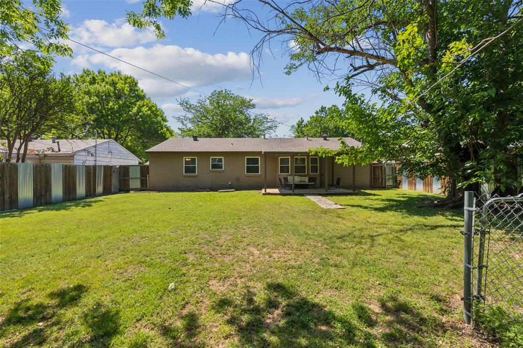1202 Johns Drive Euless, TX 76039 - Photo 24 of 26 a front view of house with yard and swimming pool