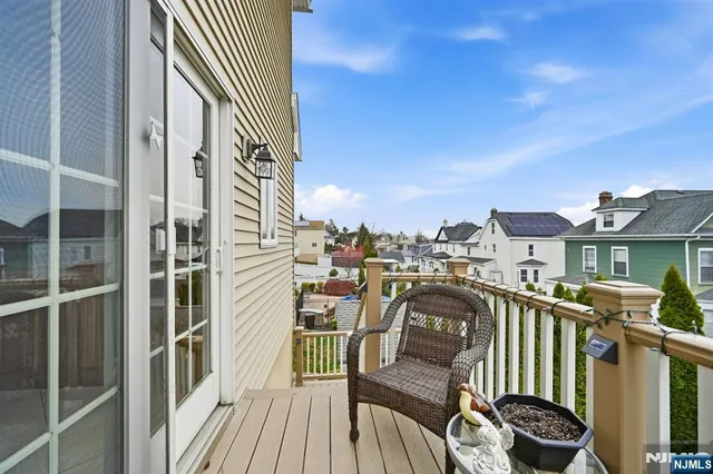 a view of a balcony with chairs