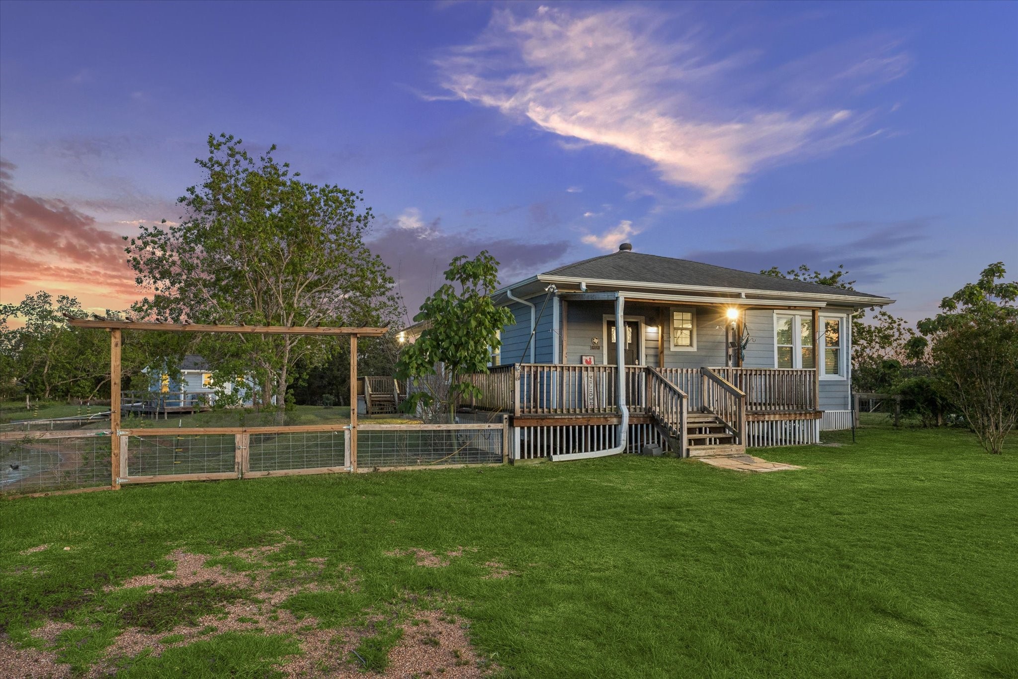 10347 Pless Road Cat Spring, TX 78933 - Photo 2 of 41 Charming single-story home with a cozy front porch. Perfect for enjoying serene evenings outdoors!