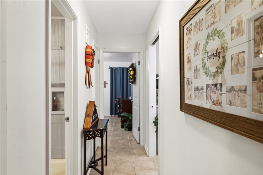 155 Harbor Circle Mathis, TX 78368 - Photo 32 of 40 a view of a hallway with paintings on the wall