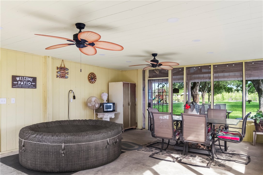 155 Harbor Circle Mathis, TX 78368 - Photo 9 of 40 a room with furniture and a chandelier