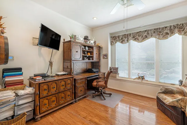 a reading room with furniture and a flat screen tv
