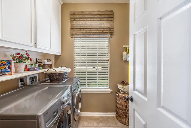 a bathroom with a sink and a window