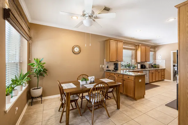 a view of a dining room with furniture and window