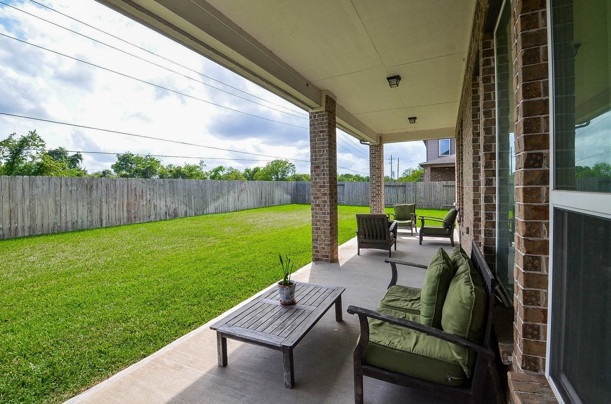 2714 Topaz Cove Lane Rosharon, TX 77583 - Photo 46 of 50 a view of backyard with seating area and green space