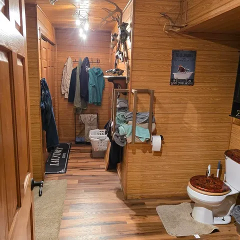 a bathroom with a toilet and a shower
