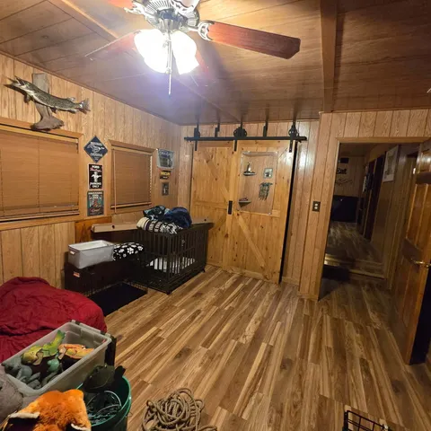 a room with lots of chairs and wooden floor