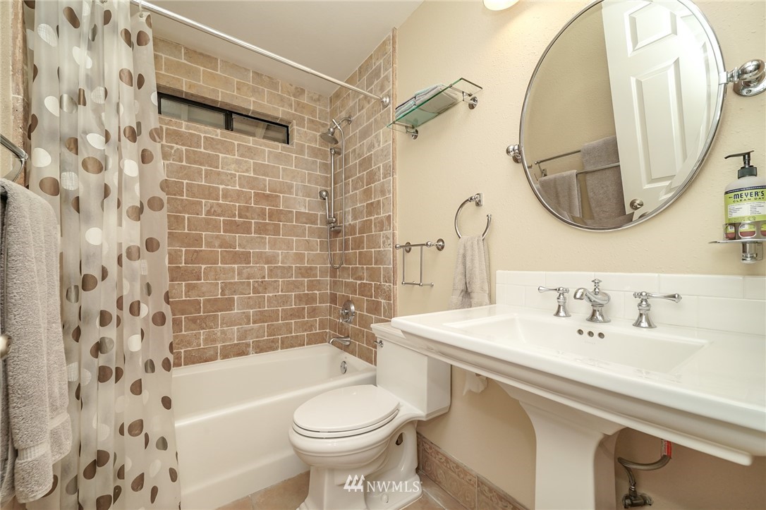 14260 145th Place Southeast Renton, WA 98059 - Photo 14 of 30 a bathroom with a sink and a mirror
