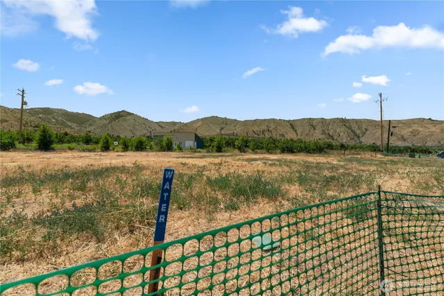 a view of lake with green space