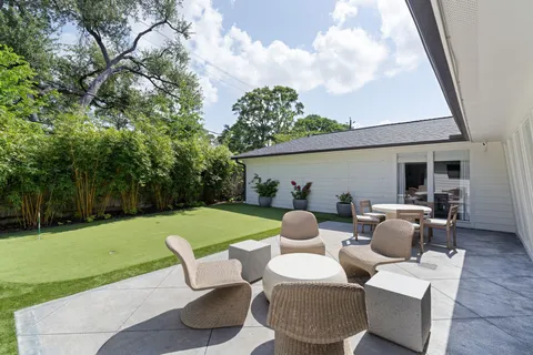 a view of a patio in the backyard