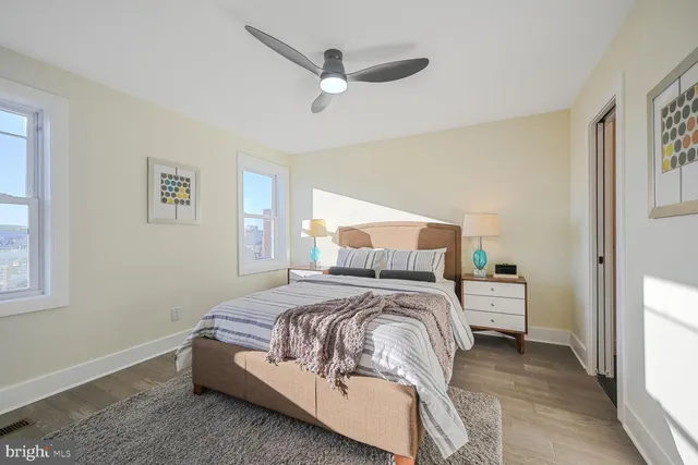 a bedroom with a bed and a window