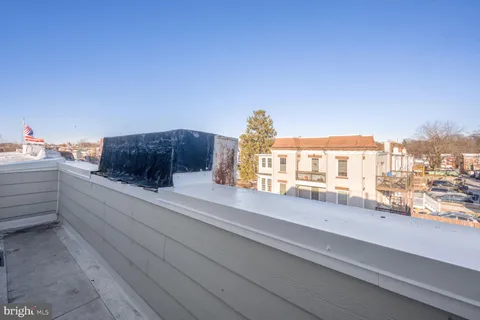 a view of a balcony with city view