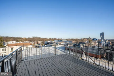 a view of roof deck with patio