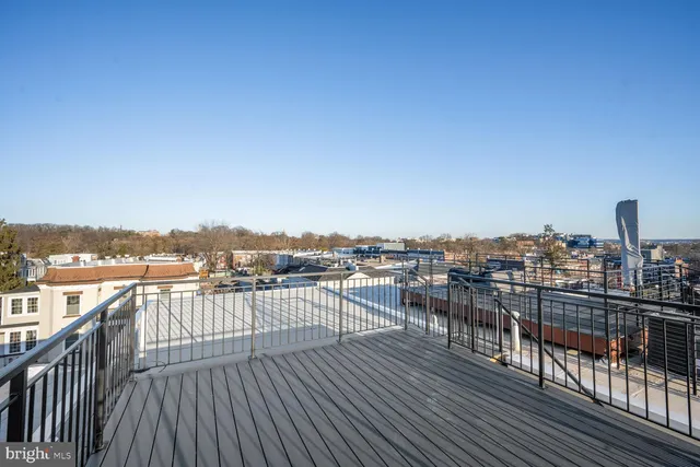 a view of roof deck with patio