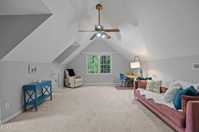 a view of living room with furniture and a chandelier