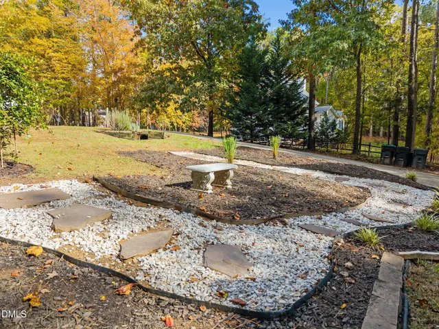 a view of a yard with large trees