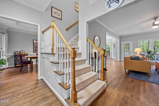 a view of entryway livingroom and hall with wooden floor