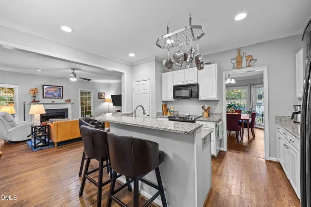 a large kitchen with a table and chairs