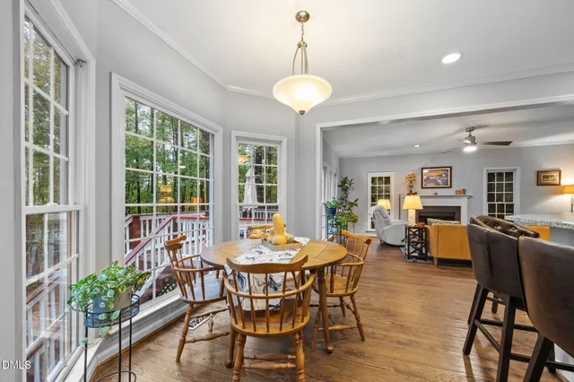 a view of a dining room with furniture window and wooden floor