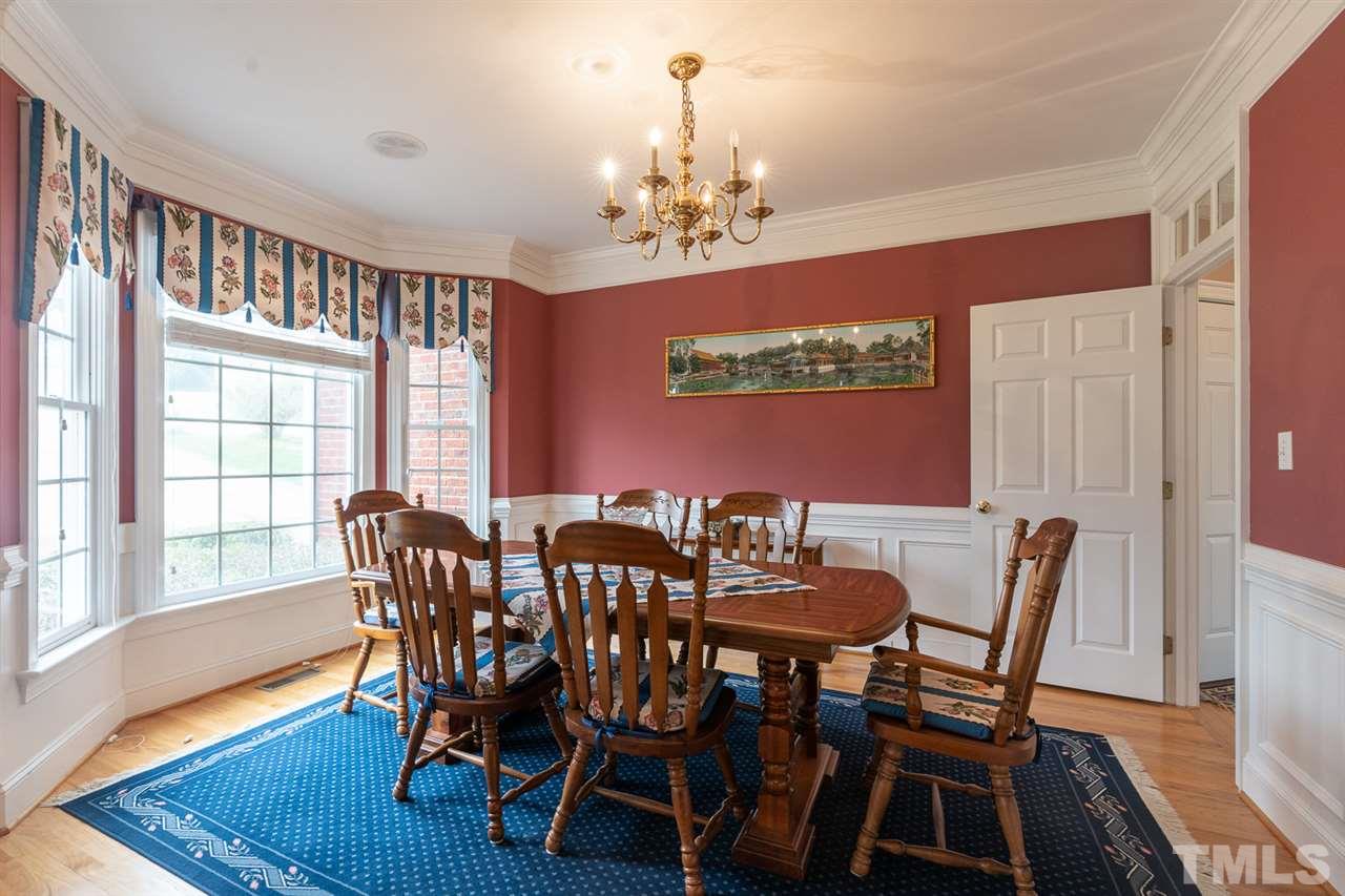 5209 Tallowtree Drive Raleigh, NC 27613 - Photo 2 of 22 a view of a dining room with furniture window and wooden floor