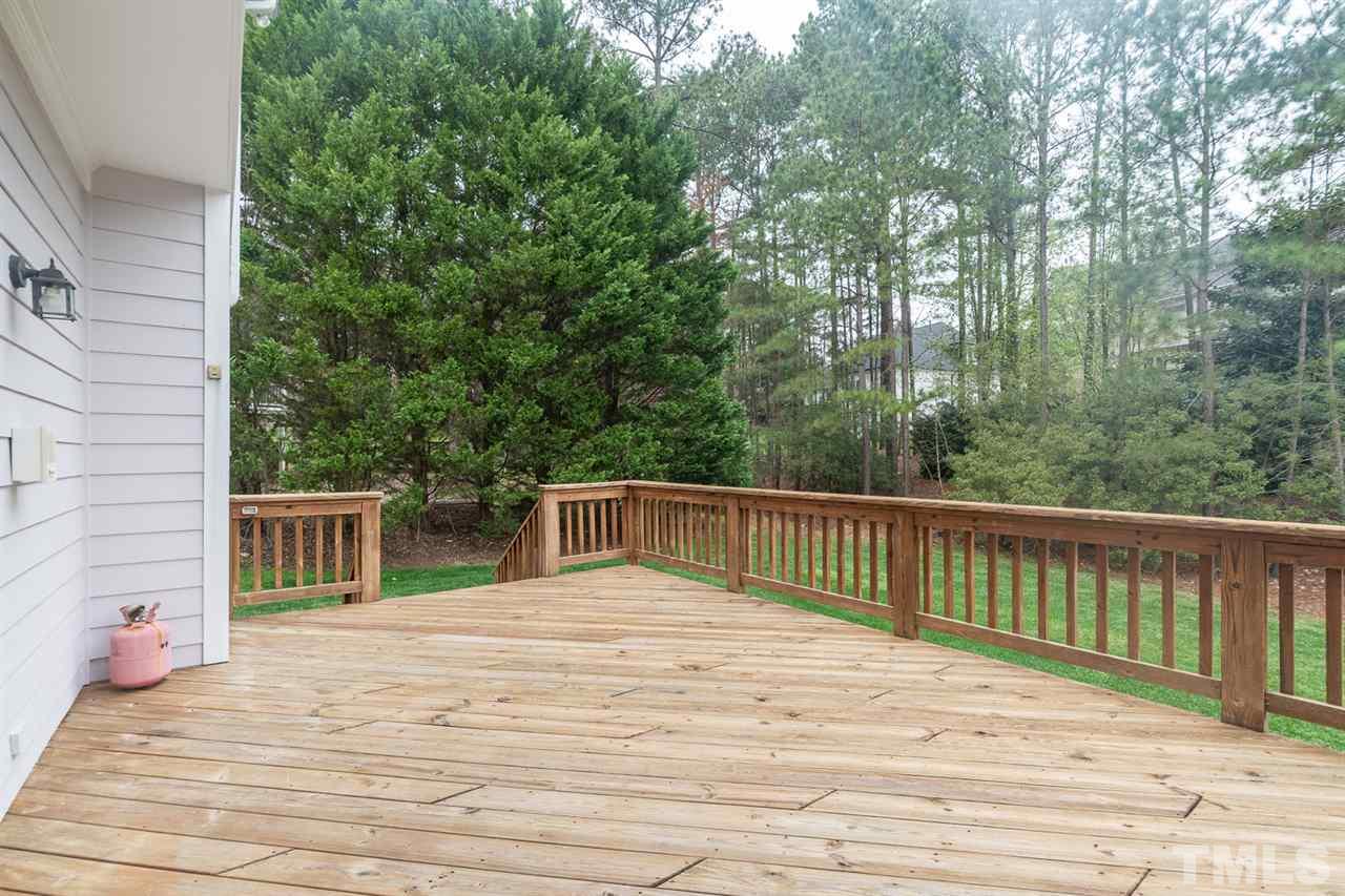 5209 Tallowtree Drive Raleigh, NC 27613 - Photo 21 of 22 a view of a house with a wooden deck