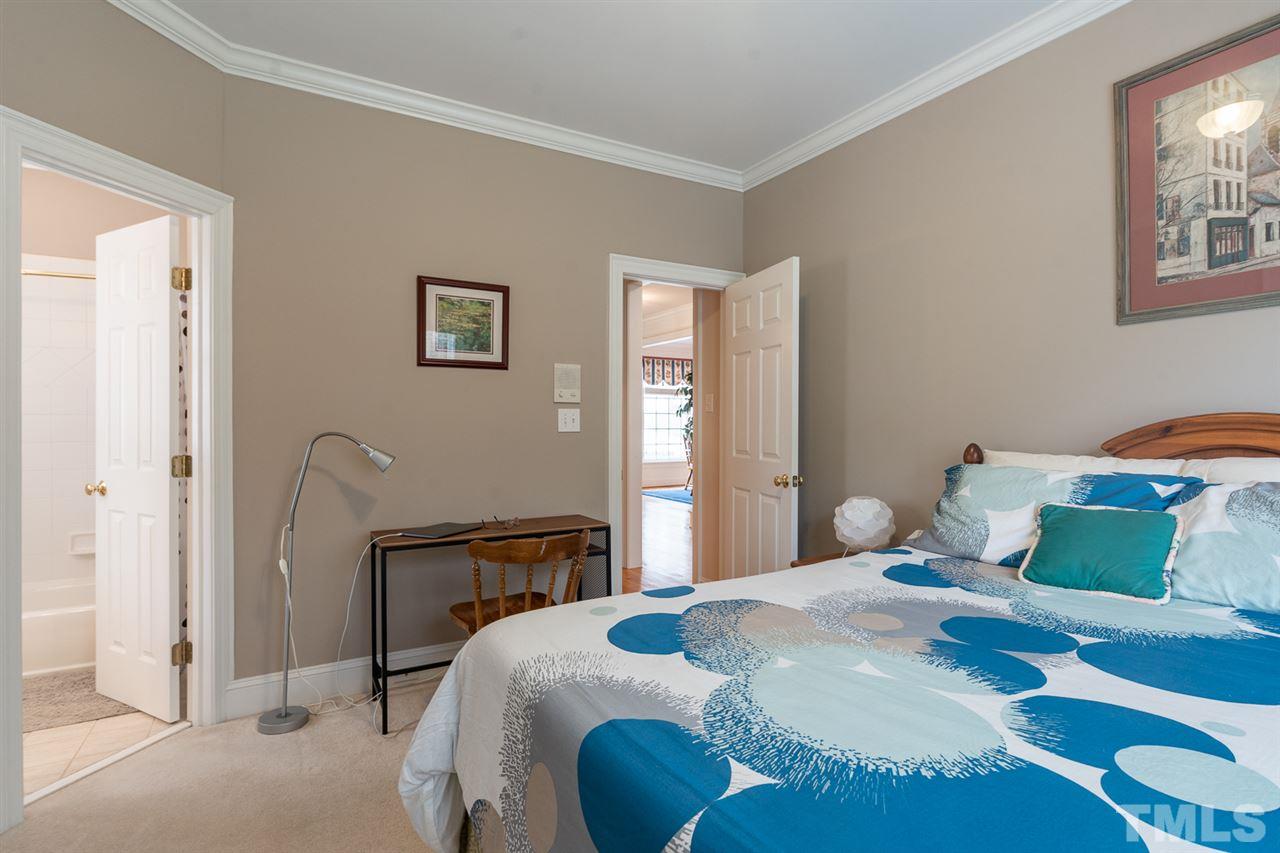 5209 Tallowtree Drive Raleigh, NC 27613 - Photo 10 of 22 a bedroom with a bed and dresser