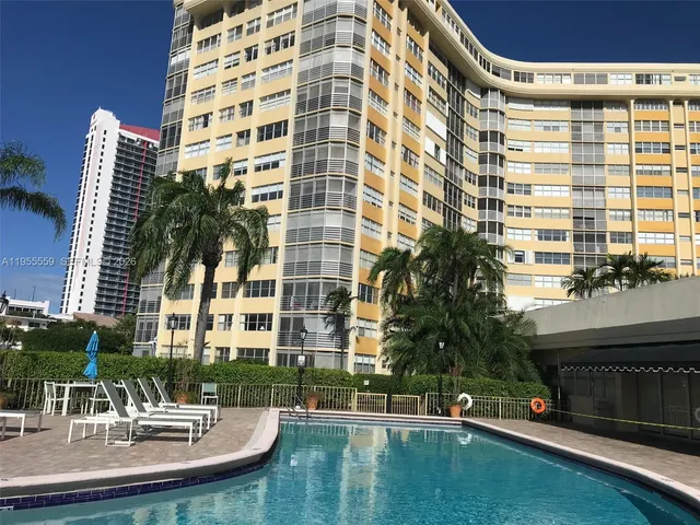 front view of a building with a swimming pool