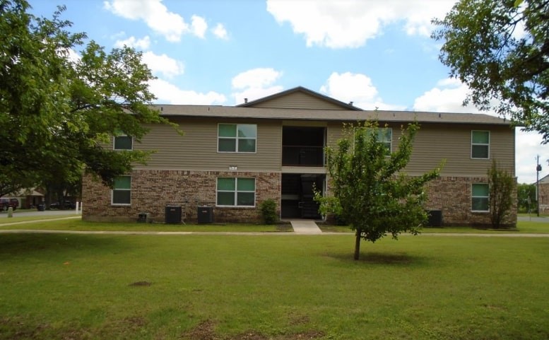 909 West 7th Street Justin, TX 76247 - Photo 5 of 11 a front view of a house with a yard