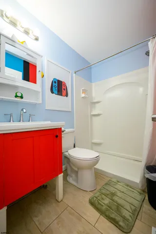 a bathroom with a toilet a sink and bathtub