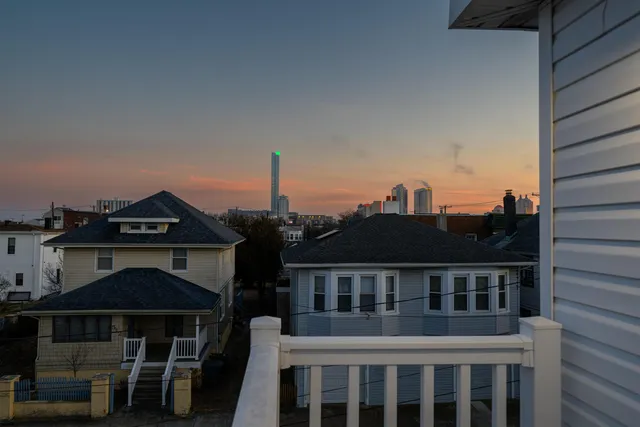 a front view of a house with a street