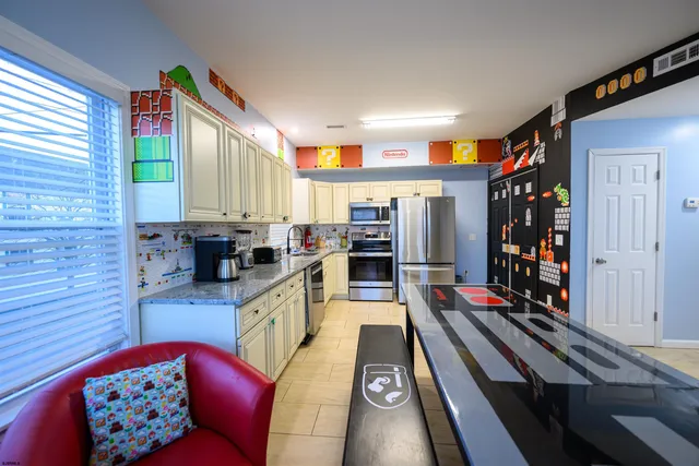 a large kitchen with lots of appliances