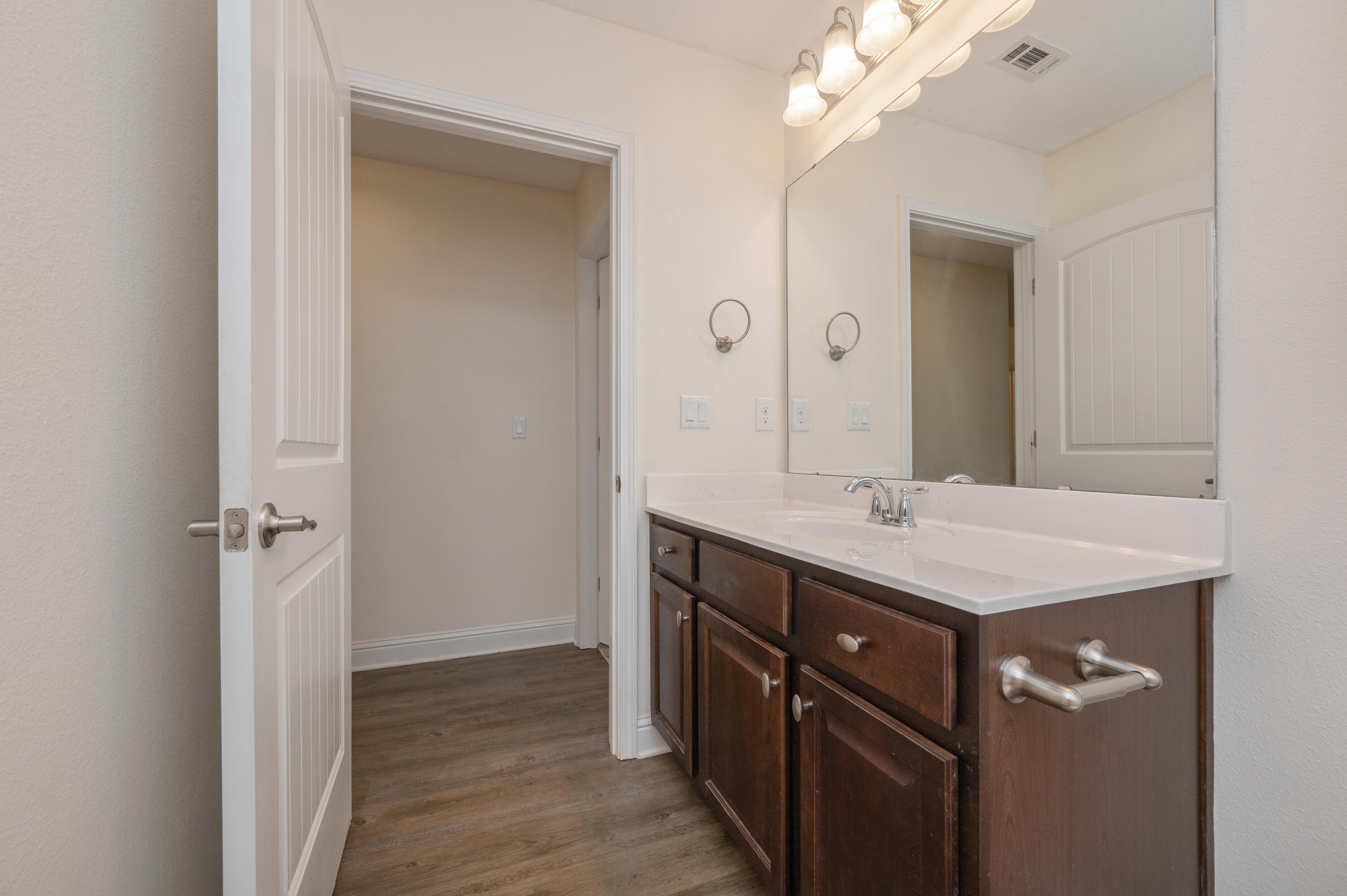 5662 North Brook Drive Crestview, FL 32539 - Photo 17 of 25 a bathroom with a sink a mirror and a shower