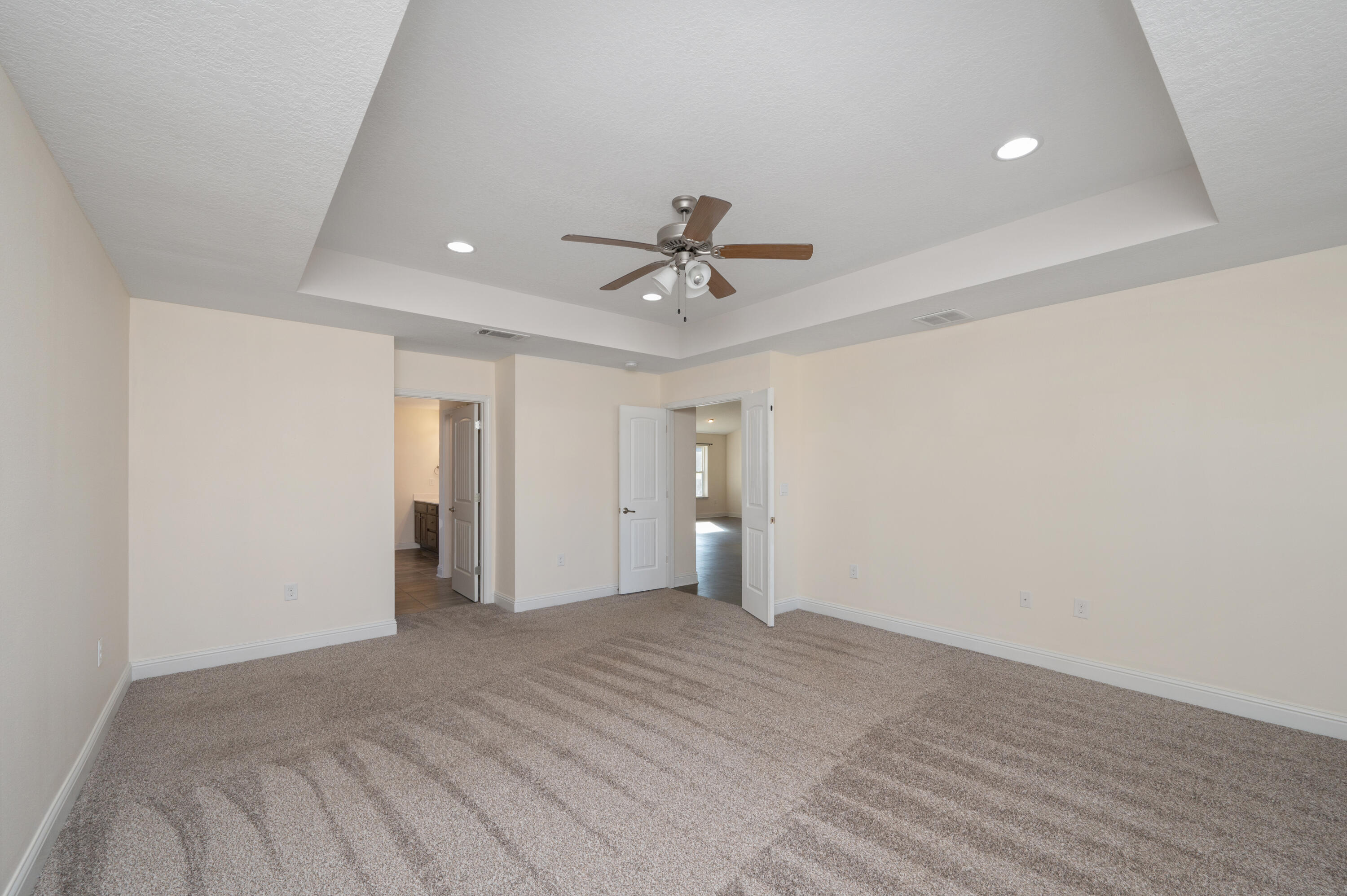 5662 North Brook Drive Crestview, FL 32539 - Photo 8 of 25 wooden floor in an empty room with a ceiling fan