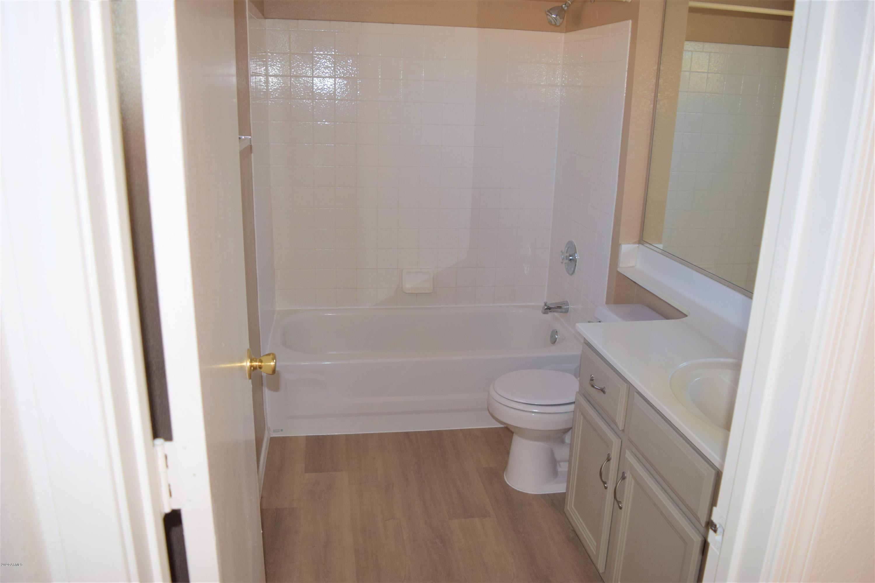 13323 East Butler Street Chandler, AZ 85225 - Photo 15 of 22 a bathroom with a toilet and a shower