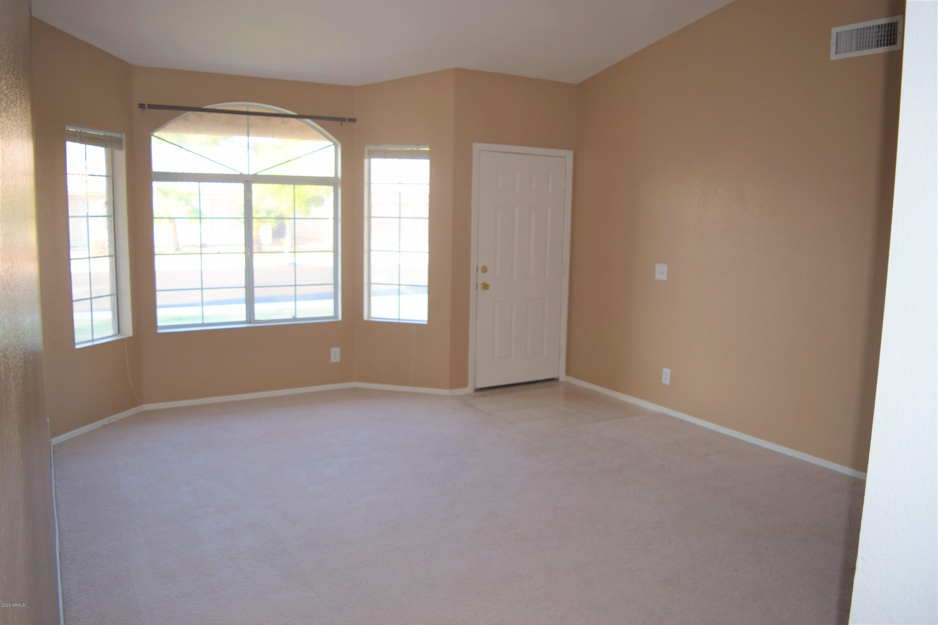 13323 East Butler Street Chandler, AZ 85225 - Photo 3 of 22 an empty room with windows