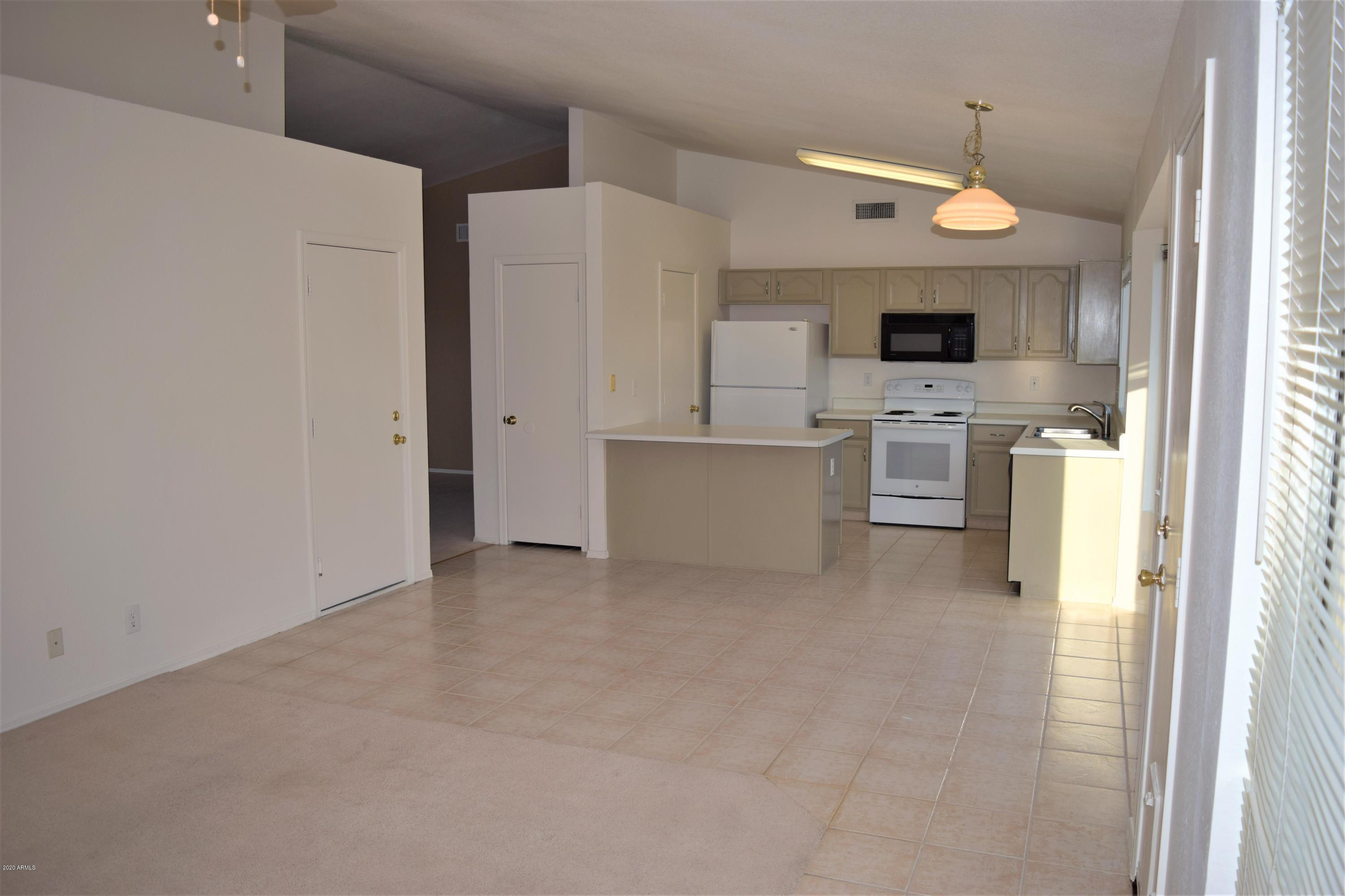 13323 East Butler Street Chandler, AZ 85225 - Photo 8 of 22 a view of kitchen with stainless steel appliances refrigerator stove microwave and cabinets