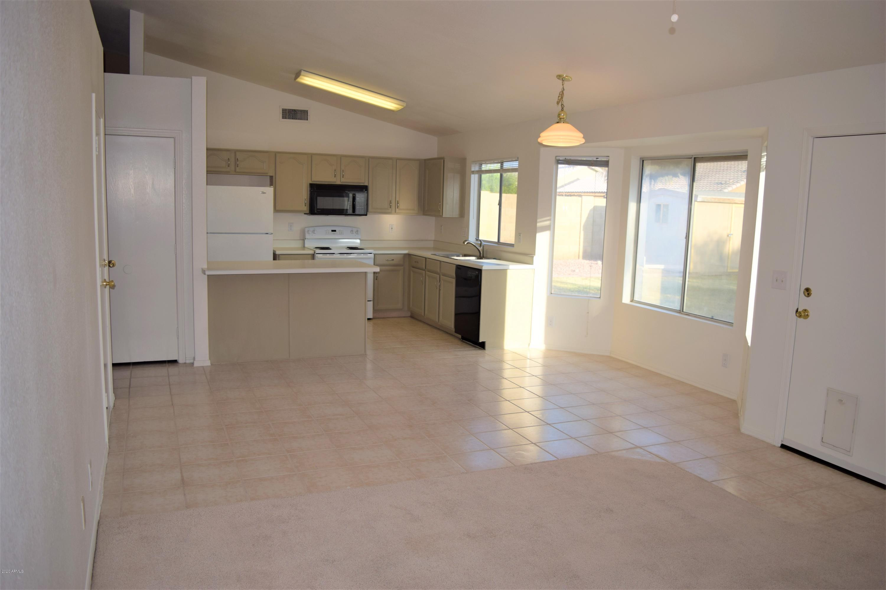 13323 East Butler Street Chandler, AZ 85225 - Photo 9 of 22 a view of a kitchen with a sink a refrigerator and window