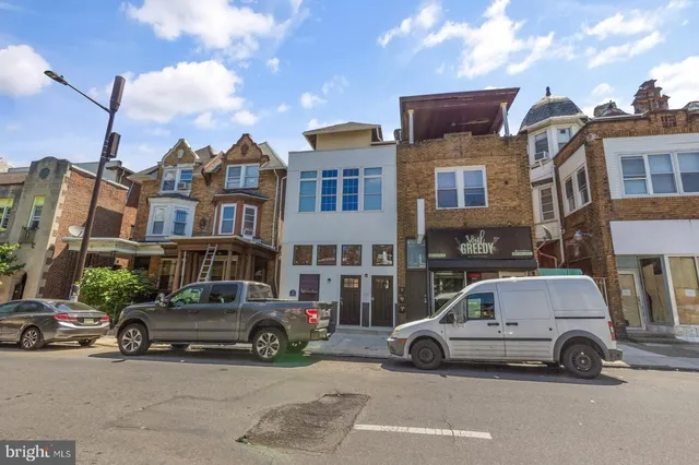 a car parked in front of a building