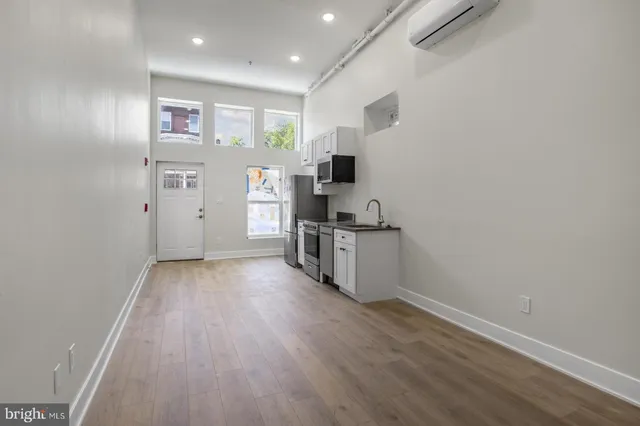 a view of kitchen with wooden floor