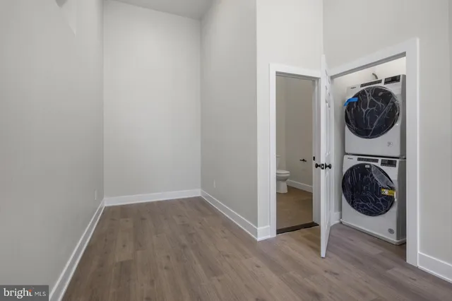 a view of a hallway with washer and dryer