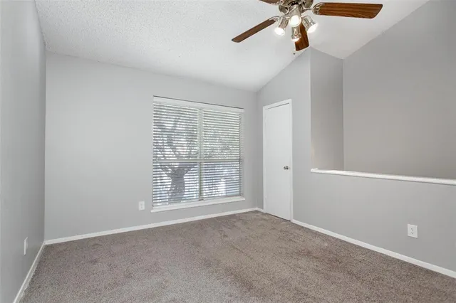 a view of a house with a small yard