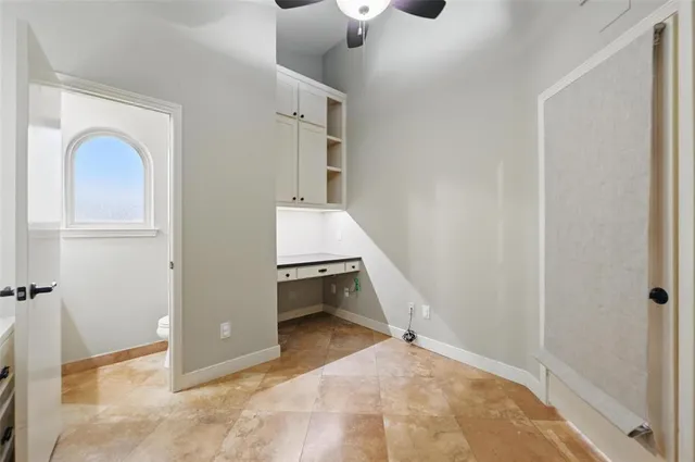 a room that has a bed and a window in it