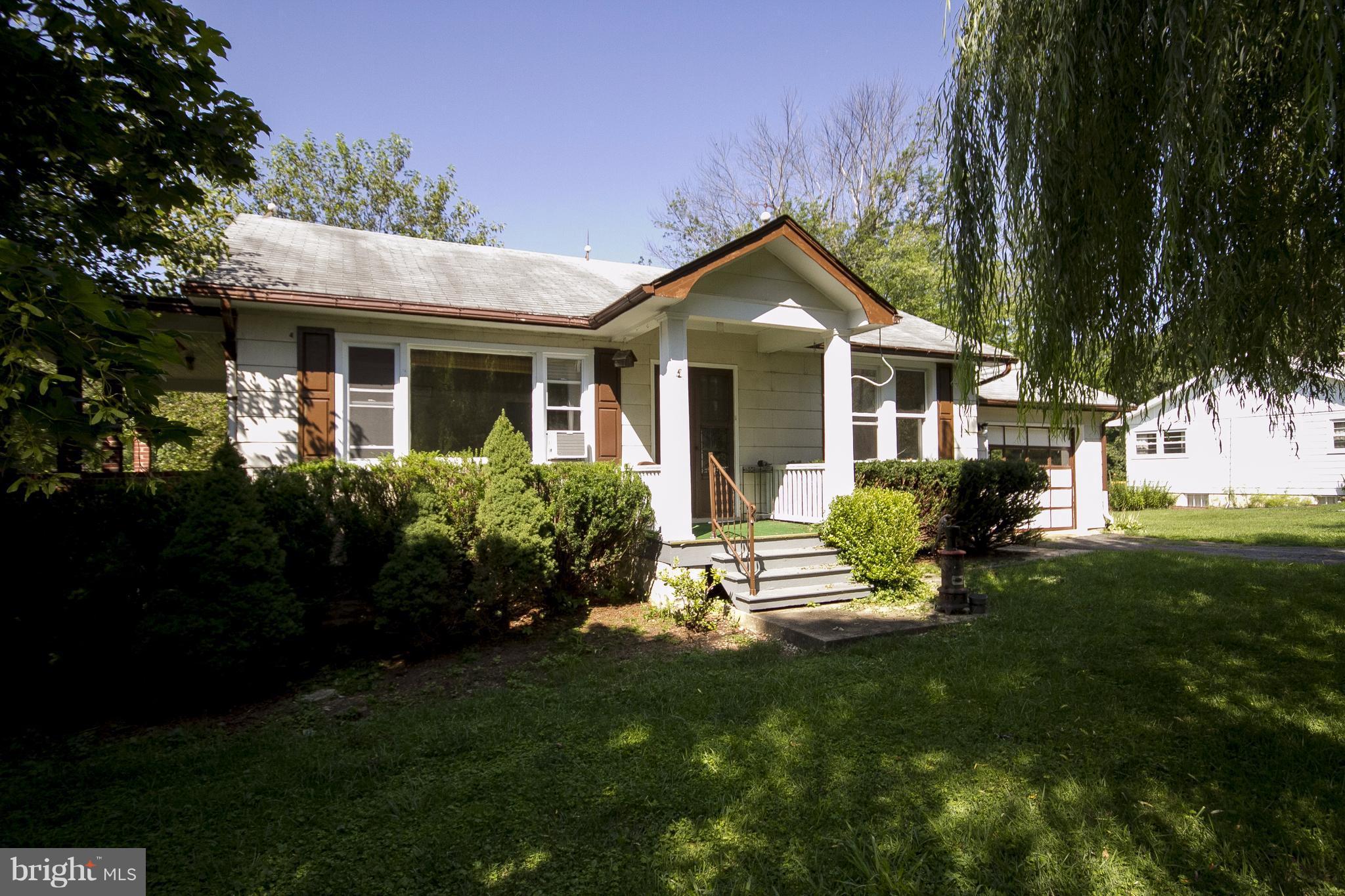 118 Byway Road Owings Mills, MD 21117 - Photo 4 of 25 a front view of a house with a garden