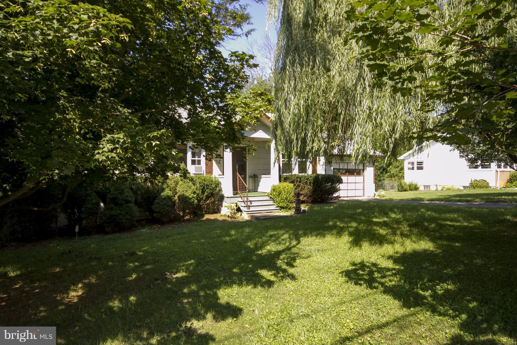 118 Byway Road Owings Mills, MD 21117 - Photo 7 of 25 a view of a house with a big yard and large trees