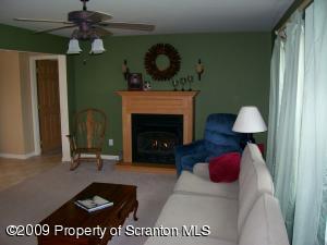 1765 Howe Road Moscow, PA 18444 - Photo 3 of 21 a living room with furniture and a fireplace