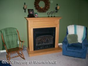1765 Howe Road Moscow, PA 18444 - Photo 5 of 21 a living room with furniture and a fireplace