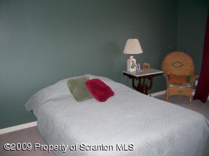 1765 Howe Road Moscow, PA 18444 - Photo 10 of 21 a bedroom with a bed and a table