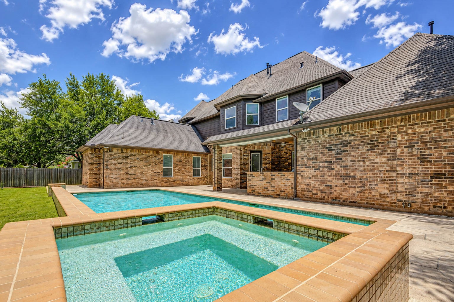 5327 Whitmore Fulshear, TX 77441 - Photo 41 of 50 Relax and unwind in the adjoining spa, ideal for year-round enjoyment and creating your own private resort experience.